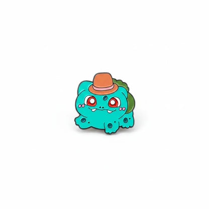 Century Fancy Beads Bulbasaur enamel lapel pin wearing a small orange hat on a white background